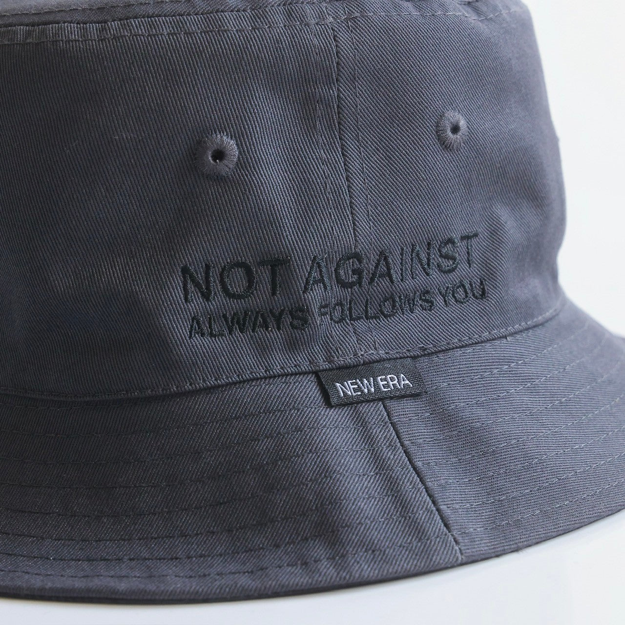 NEWERA® REVERSIBLE BUCKET HAT